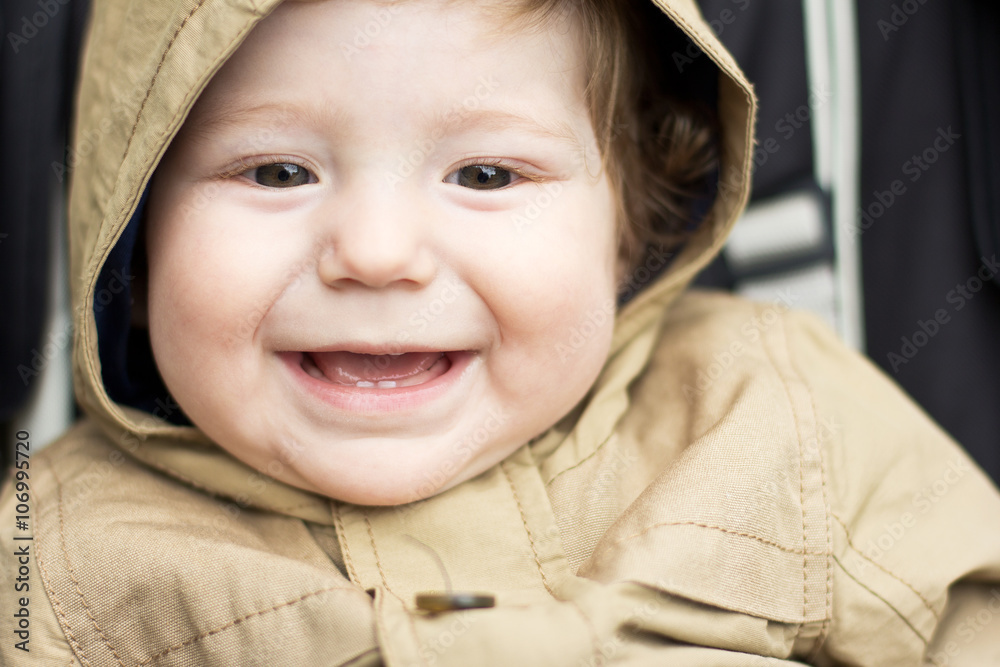 Cute baby on a walk. Autumn promenade. Headdress. A cap
Cute baby on a walk. Autumn promenade. Headdress. A cap