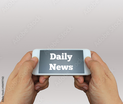 a man using hand holding the smartphone with text Daily News on