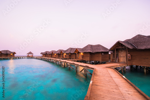 Over water bungalows with steps into amazing green lagoon 