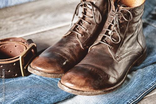 Men's casual outfits on wooden table over grunge background