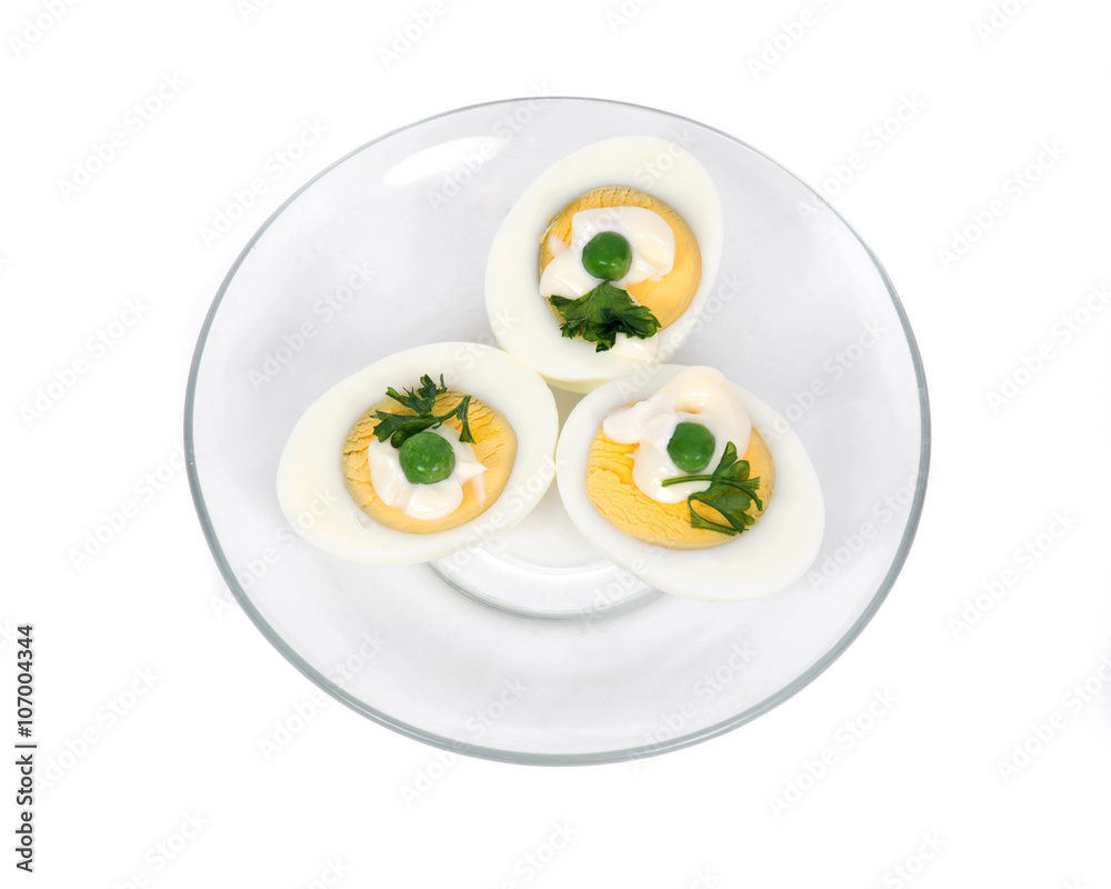 Boiled eggs with peas, parsley and mayonnaise on plate Boiled eggs with peas, parsley and mayonnaise on plate