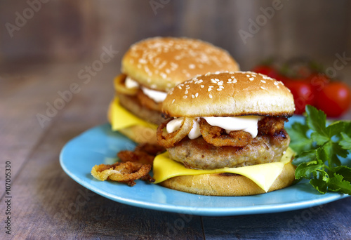 Burger with meat cutlet and caramelized onion.