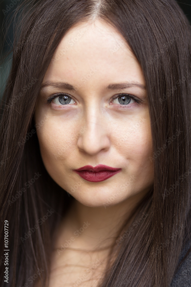 Portrait of a beautiful sensual brunette girl with red lips Portrait of a beautiful sensual brunette girl with red lips