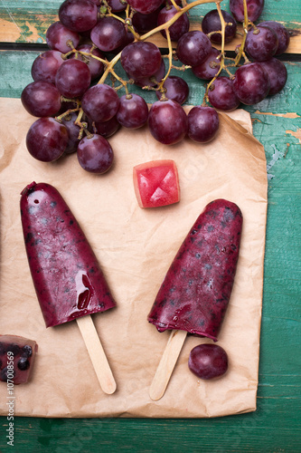 Homemade blueberry and grape ice cream on a stick