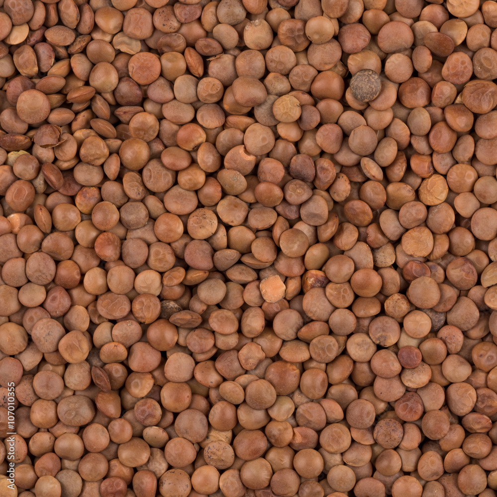 Picture of brown lentils over flat surface Picture of brown lentils over flat surface