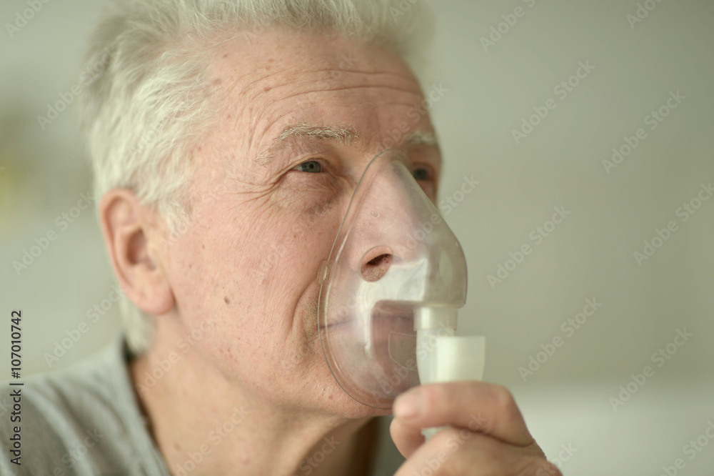 elderly man with flu inhalation