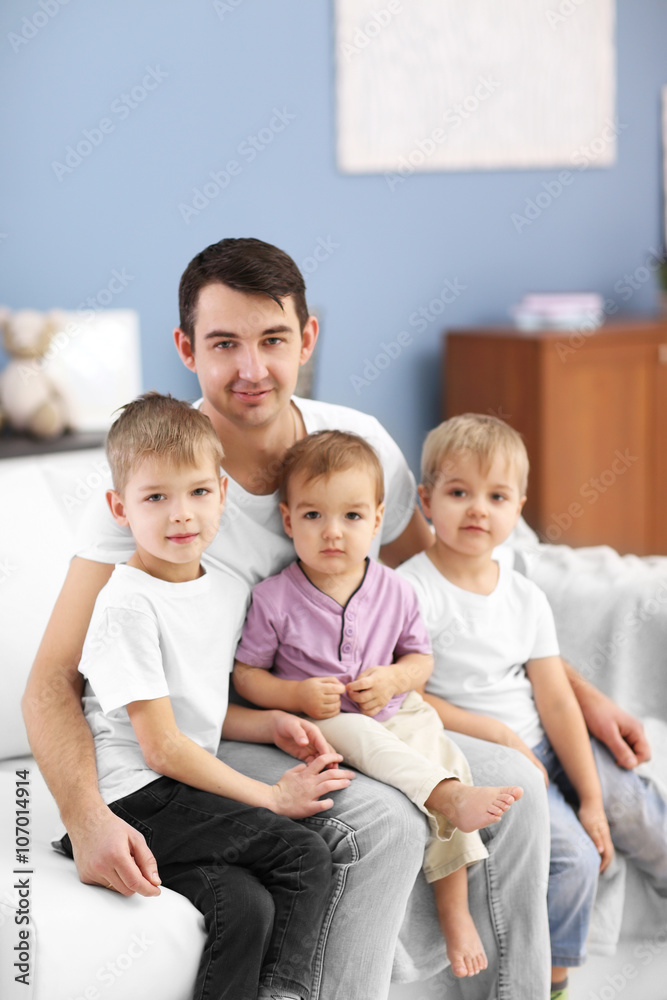 Family concept. Father with sons are in the room Family concept. Father with sons are in the room