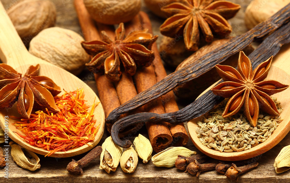 Spices for desserts on the wooden table Spices for desserts on the wooden table