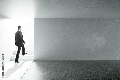 Businessman and blank wall