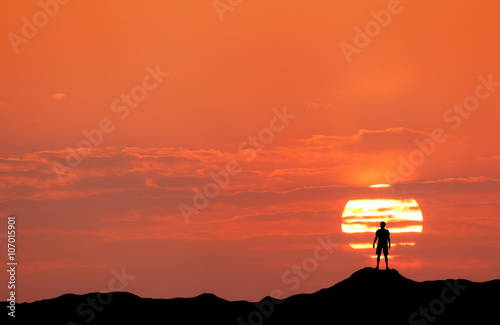 Sunset landscape with silho...