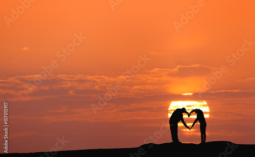 Sunset landscape with silho...