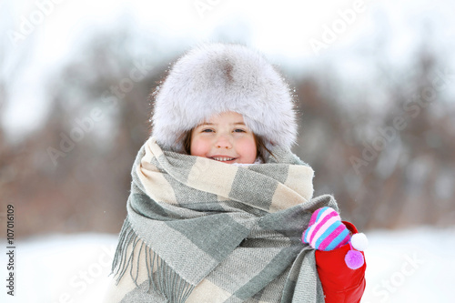 Little girl with fur hat an...