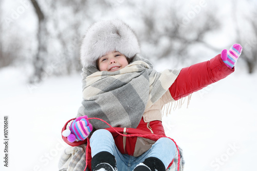Little girl with winter clo...