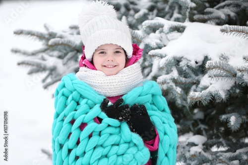 Little girl with blue cover...