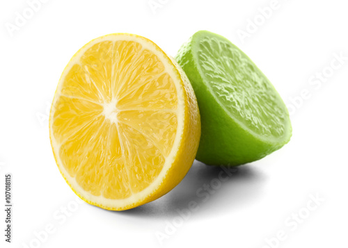 Halves of lime and lemon isolated on white