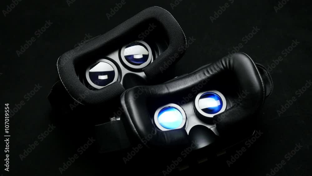 Male hand taking a virtual reality headset.
Male hand taking a virtual reality headset.