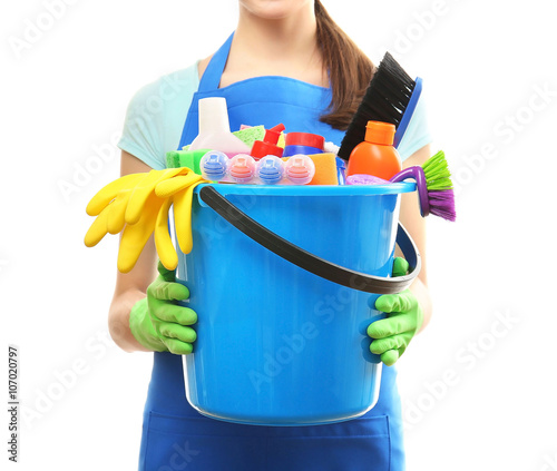 Young woman holding cleanin...