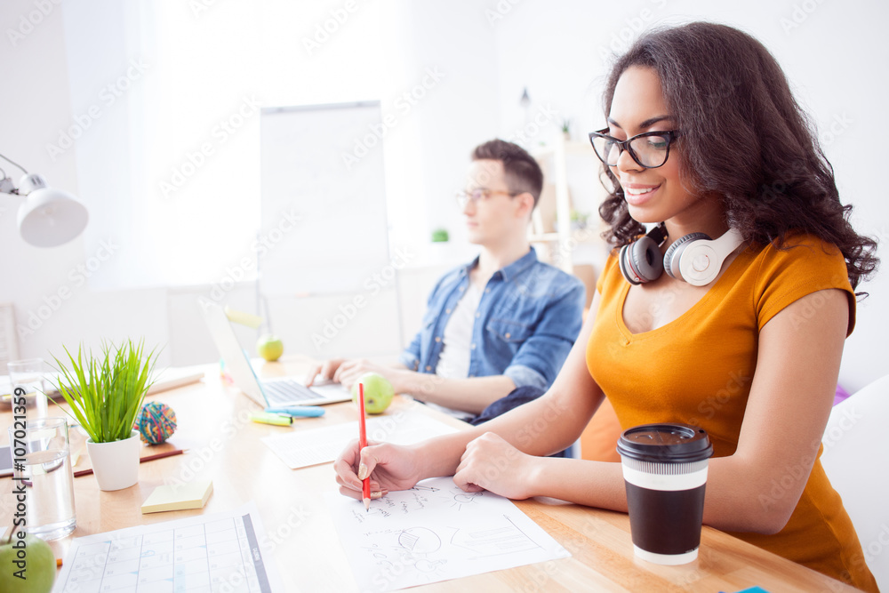 Skillful two colleagues are enjoying their work Skillful two colleagues are enjoying their work