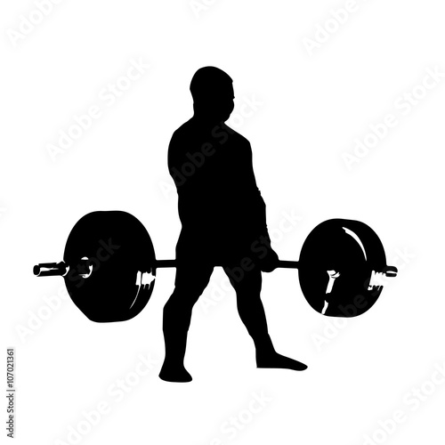 silhouette of man with barbell deadlift