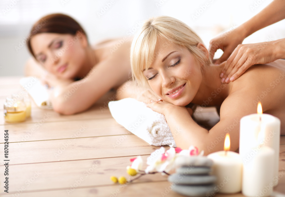 Two young beautiful women relaxing and enjoying at the spa center Two young beautiful women relaxing and enjoying at the spa center