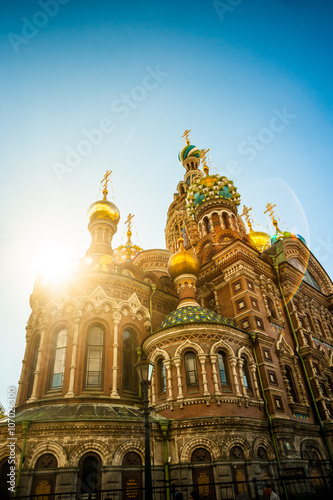 Church of the Savior on Blood against bright sun with lens flare in Saint-Petersburg, Russia. One of the main touristic attractions in the city.