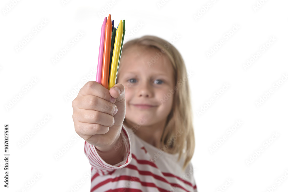 6 or 7 years old beautiful little girl holding multicolor crayons set in art school children education concept isolated on white background 6 or 7 years old beautiful little girl holding multicolor crayons set in art school children education concept isolated on white background