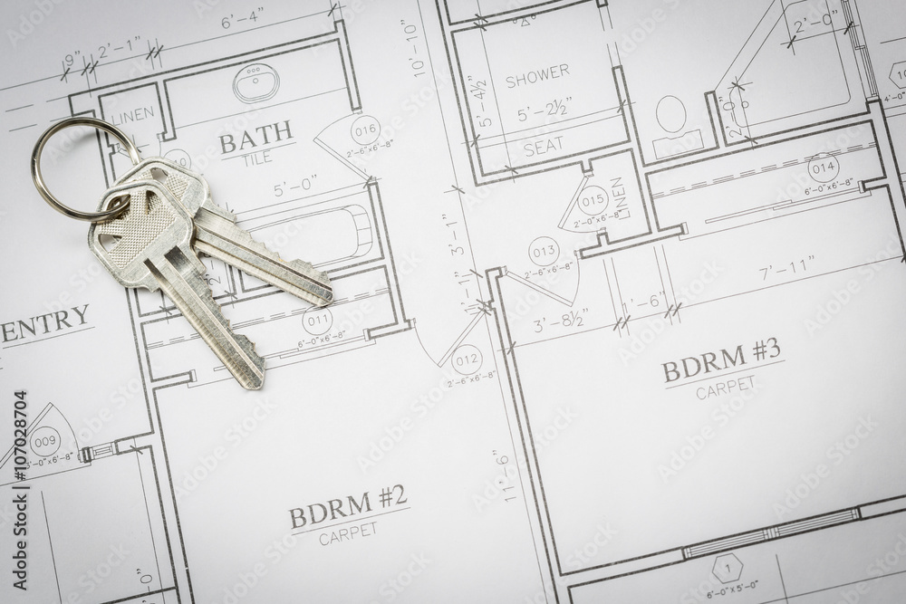 © Andy Dean - Set Of New House Keys Resting On House Plans