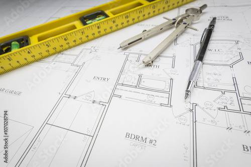 Construction Level, Pencil, Ruler and Compass Resting on House P