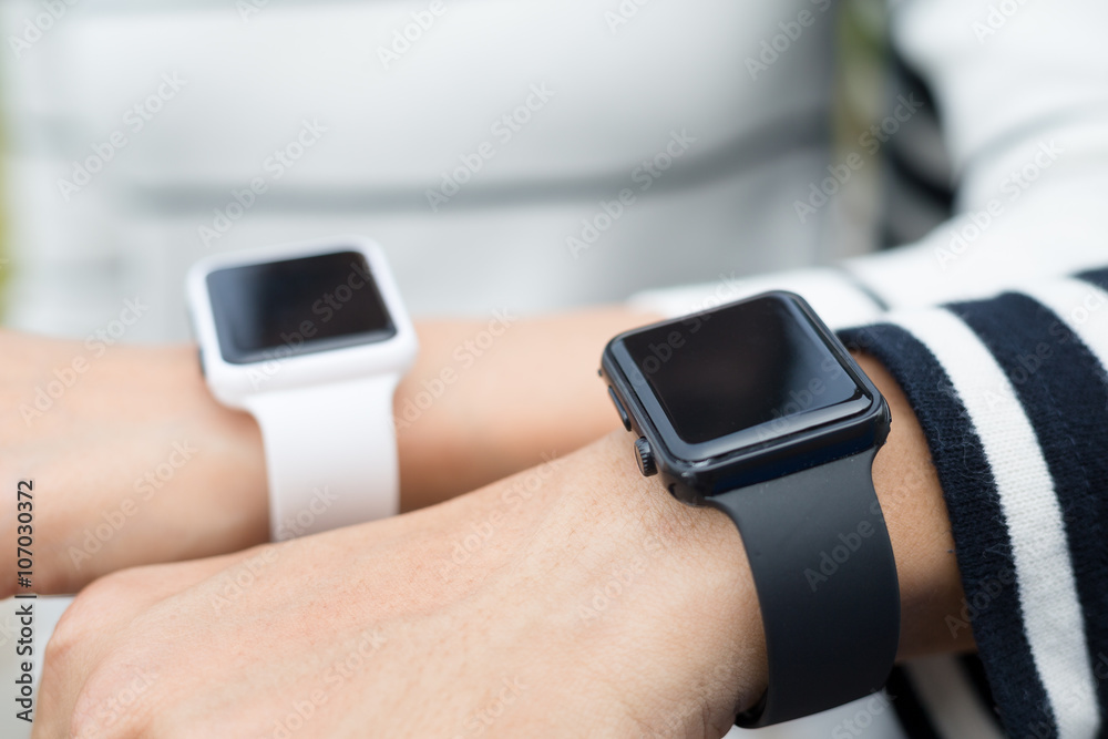 Couple wearing smartwatch together Couple wearing smartwatch together