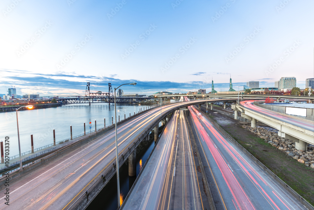 traffic on road with cityscape and skyline of portland