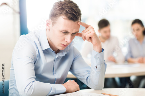 Thoughtful man sitting at the table