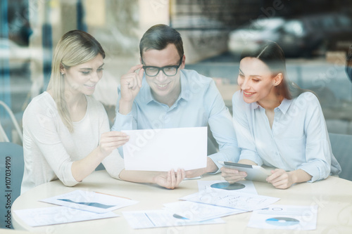 Cheerful professional team discussing the project