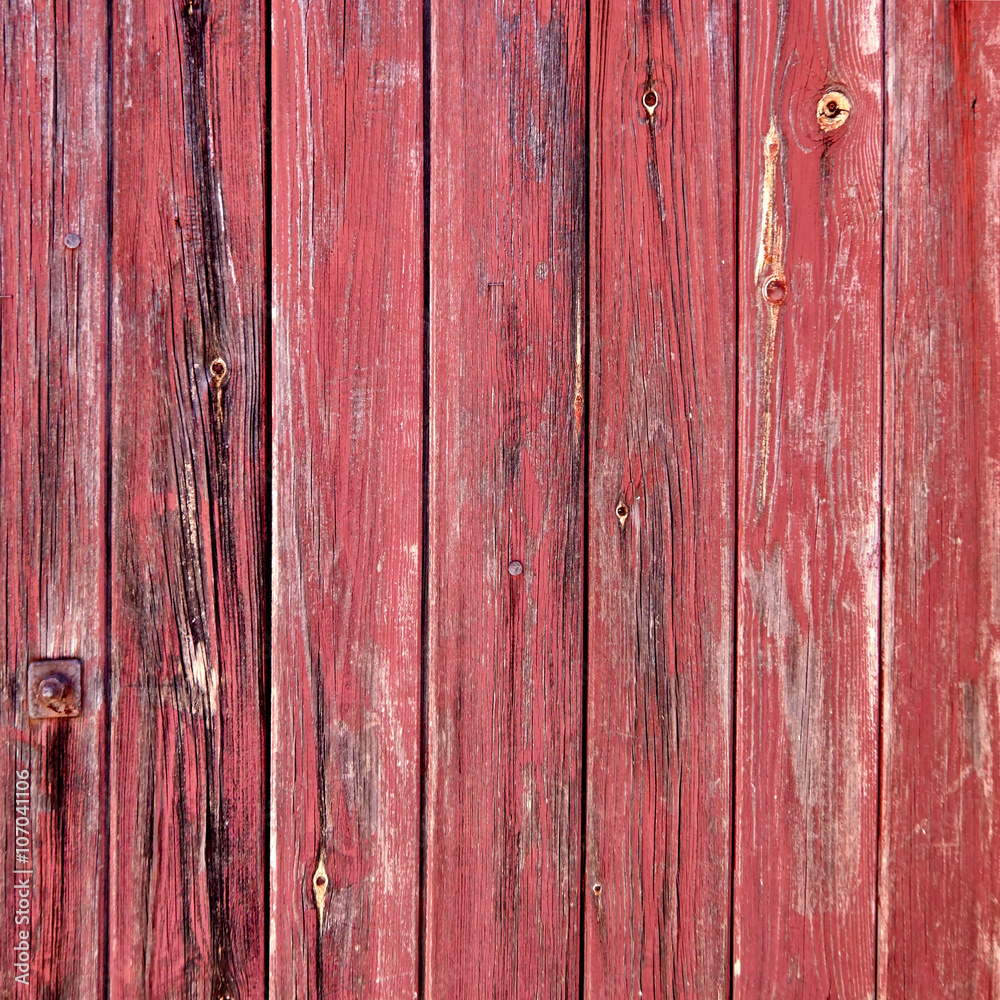 red painted weathered wood stripes closeup