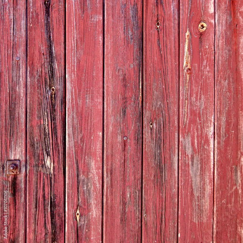 red painted weathered wood stripes closeup