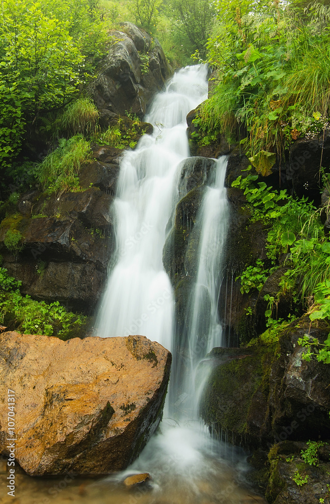 Waterfall in canyon. Beautiful natural landscape