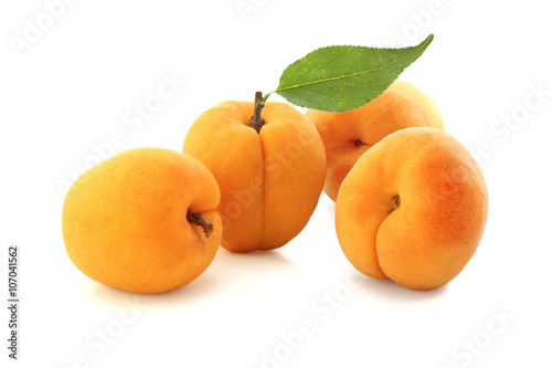 Apricots with leaf isolated on white