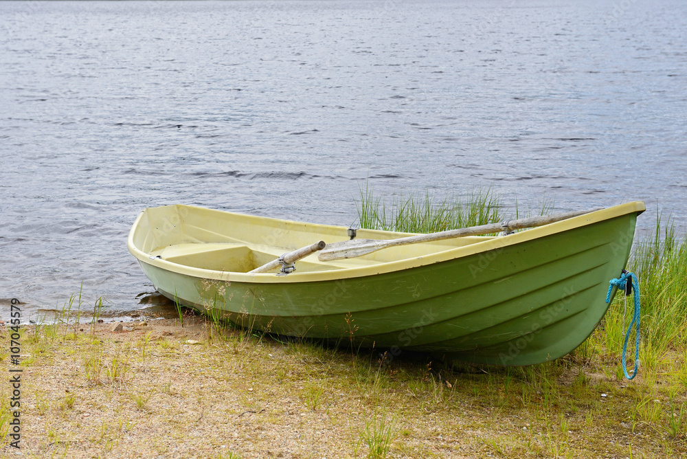 Green boat on the lake. Northern Finland, Lapland Green boat on the lake. Northern Finland, Lapland