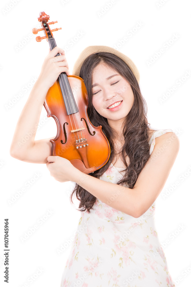 Asian woman and violin isolated over white background Asian woman and violin isolated over white background