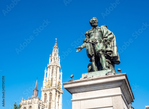 Wallpaper Mural Statue of Peter Paul Rubens with Cathedral of Our Lady in Background in Antwerp, Belgium, under clear blue sky. The cathedral is the highest church in the Benelux with 123 m (404 ft) of height. Torontodigital.ca