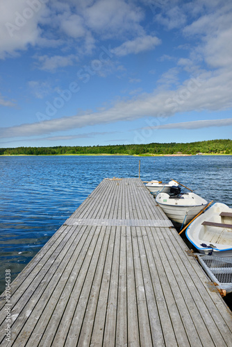 Pier on blue lake. Finland