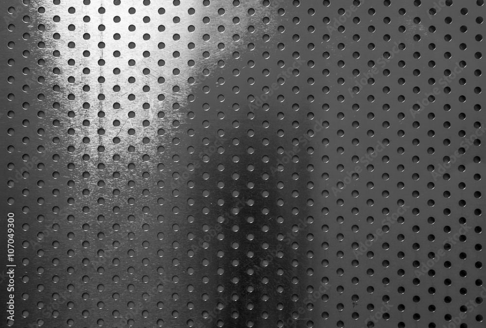 Black aluminum with circle patterns texture background