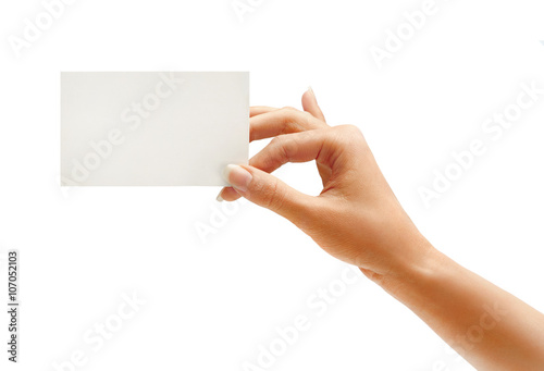 Woman's hand holding business card isolated on white background. Close up