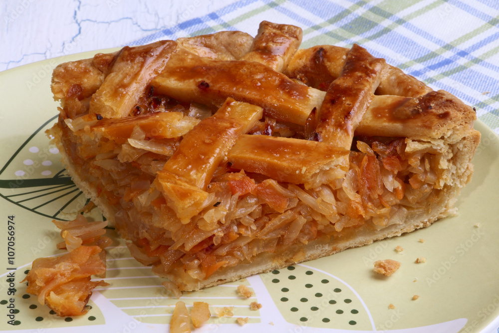 Cabbage pie section on crockery plate Cabbage pie section on crockery plate