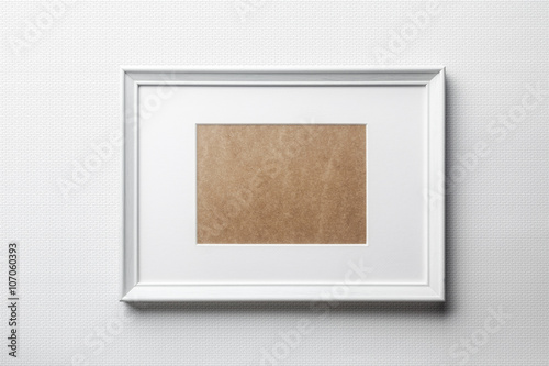 White plain empty  wood picture frame with white mat passe-partout on white bricks background