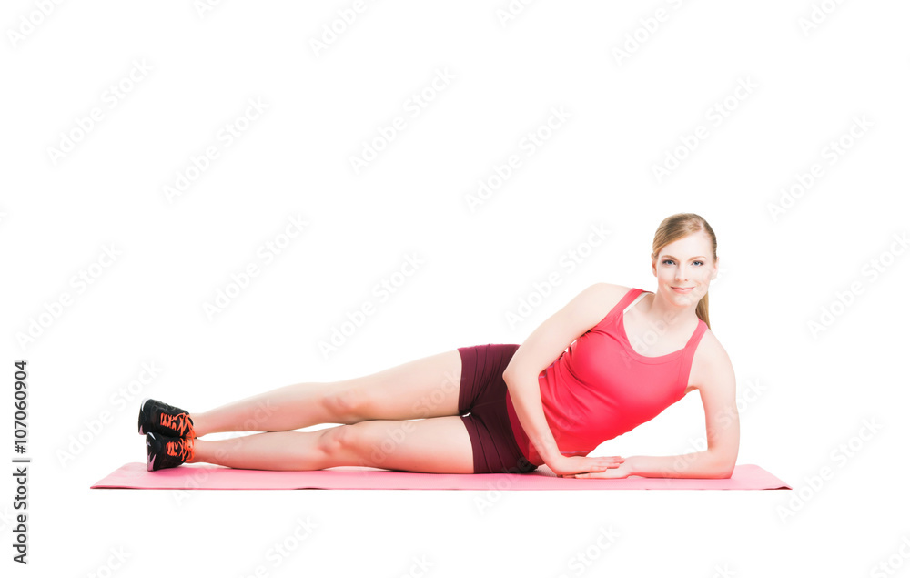 Obraz premium Fit woman in sportswear doing physical exercises
