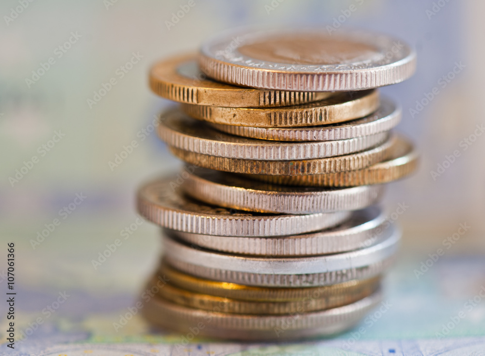 coins of different countries against 20 euro banknote background coins of different countries against 20 euro banknote background