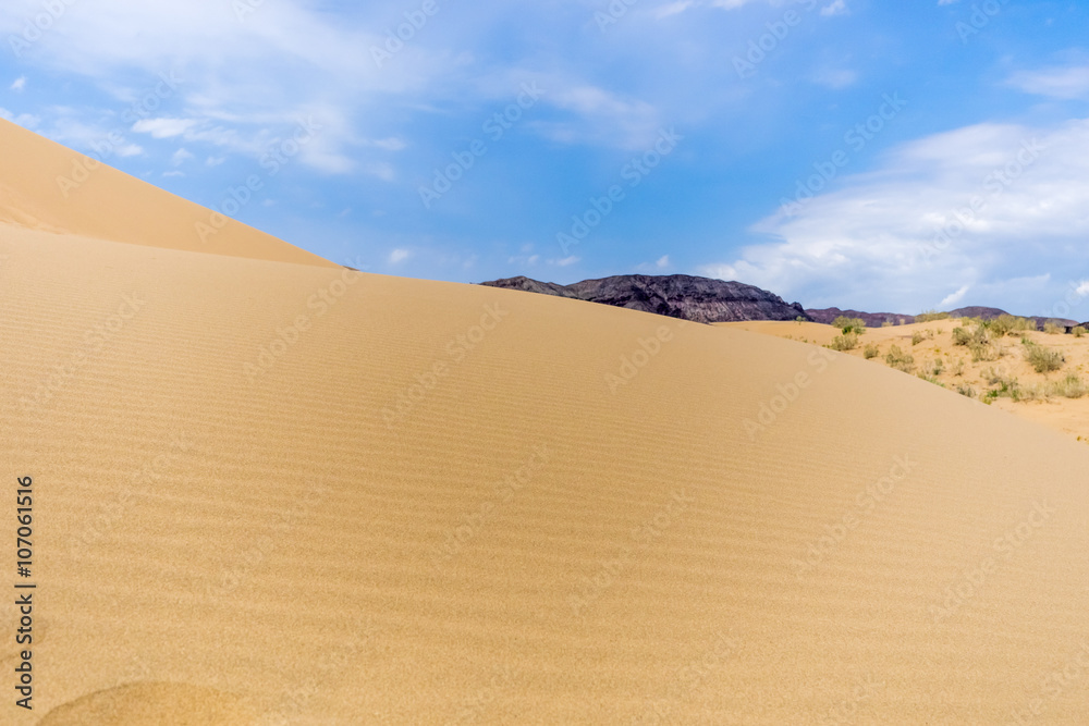 sand dune on a background of mountains sand dune on a background of mountains