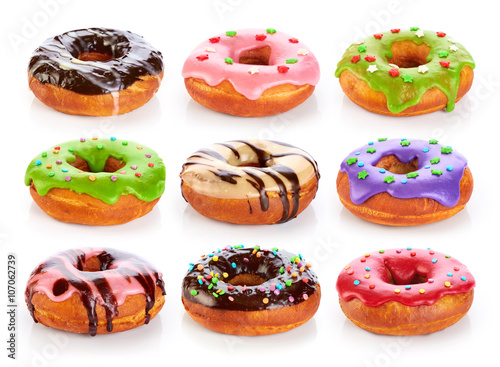 Donuts with colored glaze and chocolate, isolated on white backg
