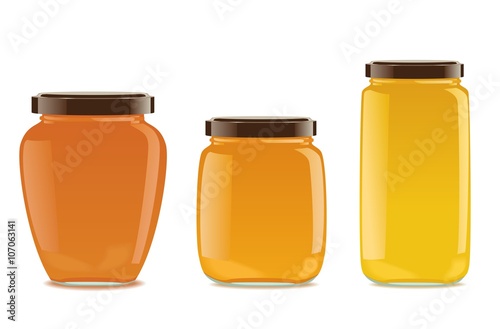 Three glass jars with jam or honey