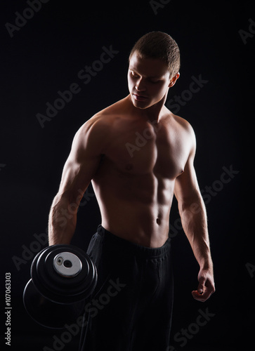 Bodybuilder man with a dumbbell